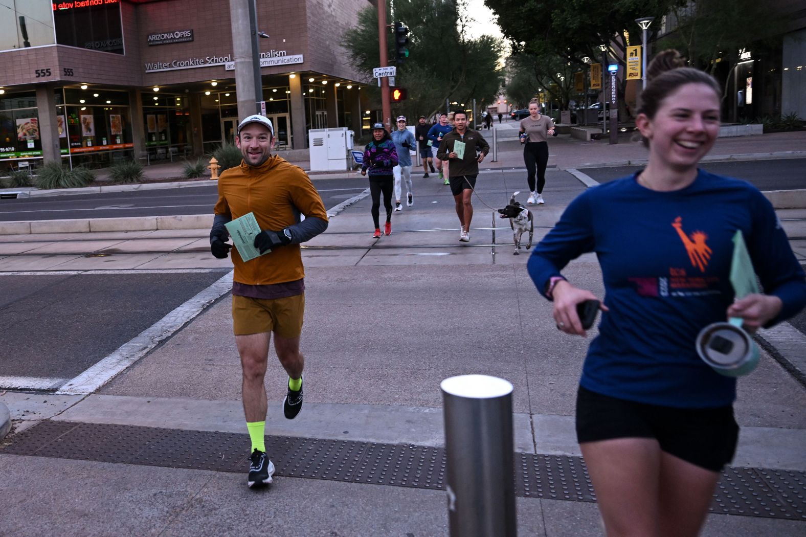 Members of a running group arrive at a polling station in Phoenix to drop off their ballots on Tuesday.