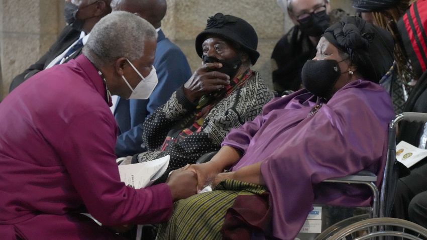 Archbishop of Cape Town Thabo Makgoba (L) greets Leah Tutu (R), widow of South African anti-Apartheid icon Archbishop Desmond Tutu, during Tutu's requiem mass at St. Georges Cathedral in Cape Town on January 1, 2022. - Tutu died on December 26, 2021 at the age of 90, triggering grief among South Africans and tributes from world leaders for a life spent fighting injustice. (Photo by Nic BOTHMA / POOL / AFP) (Photo by NIC BOTHMA/POOL/AFP via Getty Images)