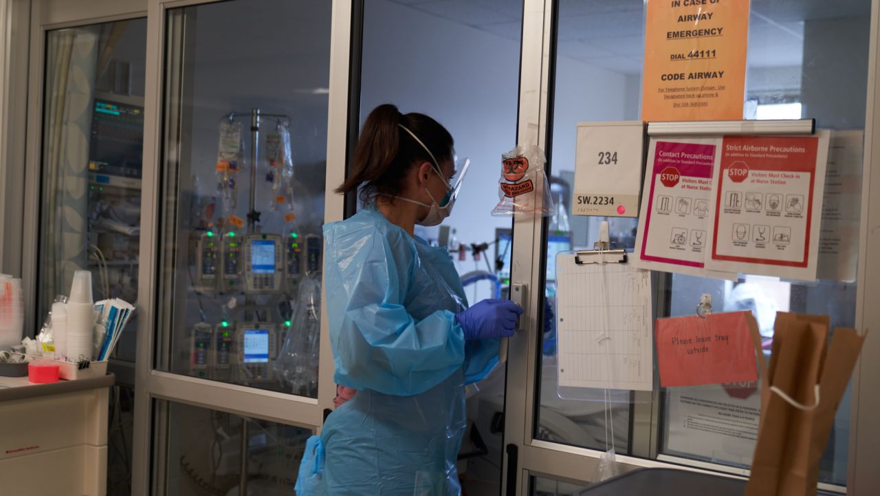 Healthcare workers treat patients on the Covid-19 ICU floor of the University of Massachusetts (UMass) Memorial Hospital in Worcester, Massachusetts, U.S., on Monday, Dec. 27, 2021. On Friday, the Massachusetts Department of Public Health reported 10,040 new confirmed Covid cases, marking the third consecutive day that a record was set for most cases in a single day in the state. Photographer: Allison Dinner/Bloomberg via Getty Images