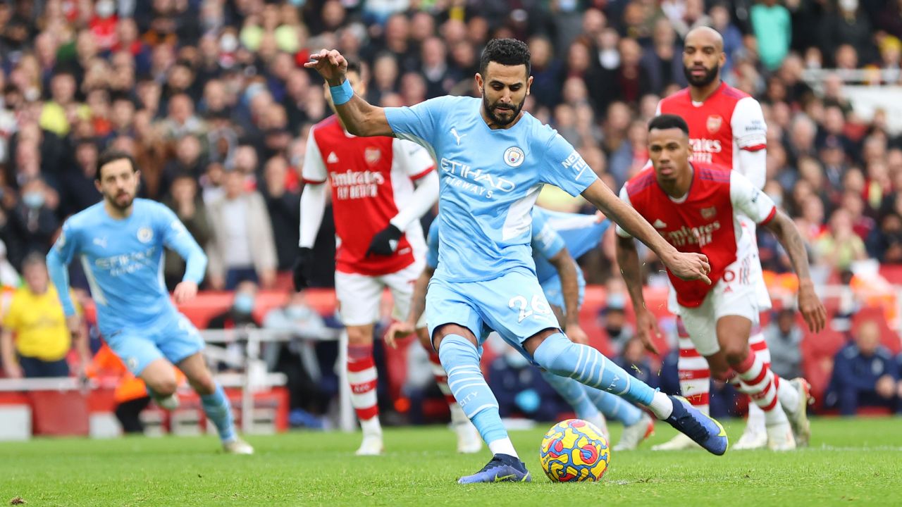 Riyad Mahrez scores Manchester City's equalizer in the 2-1 win over Arsenal.