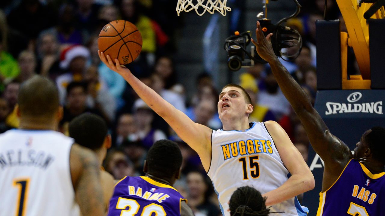 Nikola Jokic (15) of the Denver Nuggets puts up a layup up during the fourth quarter at the Pepsi Center on December 22, 2015 in Denver, Colorado. The Lakers defeated the Nuggets 111-107.