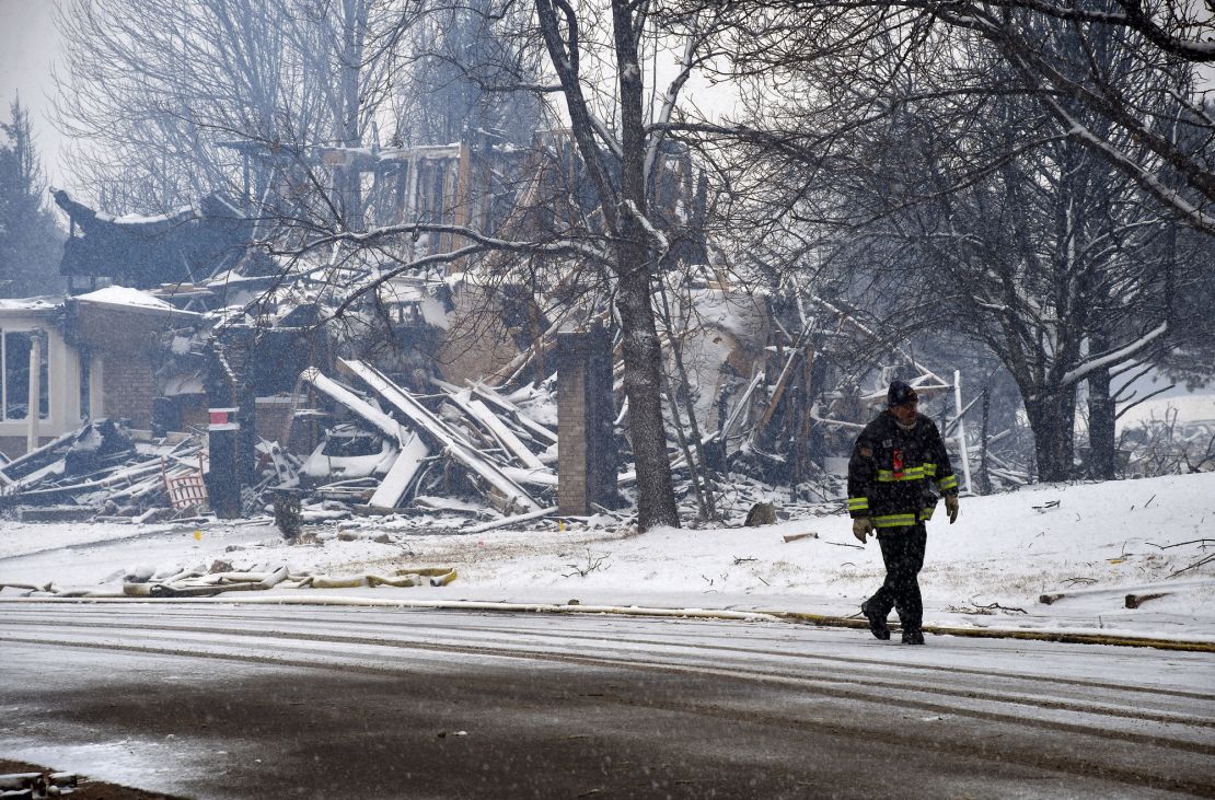 A destroyed home is covered in snow in Louisville, Colorado, on Friday, December 31, 2021, a day after a wildfire swept the area.