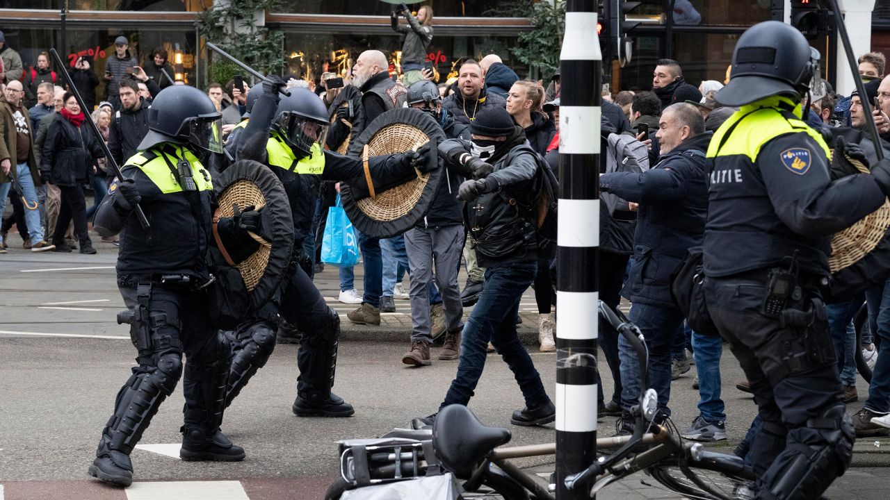 Police clash with demonstrators in Amsterdam, who were protesting the Dutch government's Covid-19 lockdown measures 