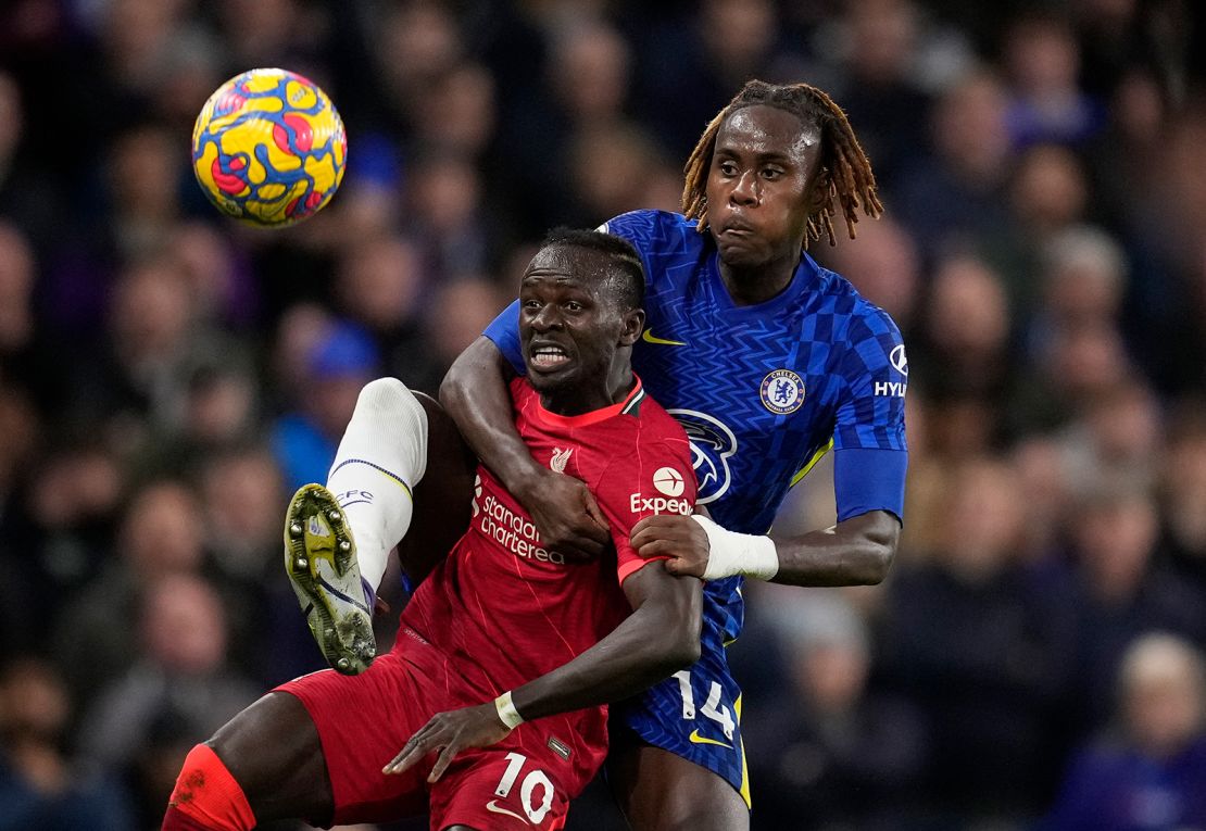 Chelsea's Trevoh Chalobah, rear, challenges Liverpool's Sadio Mane during the Premier League  game at Stamford Bridge.