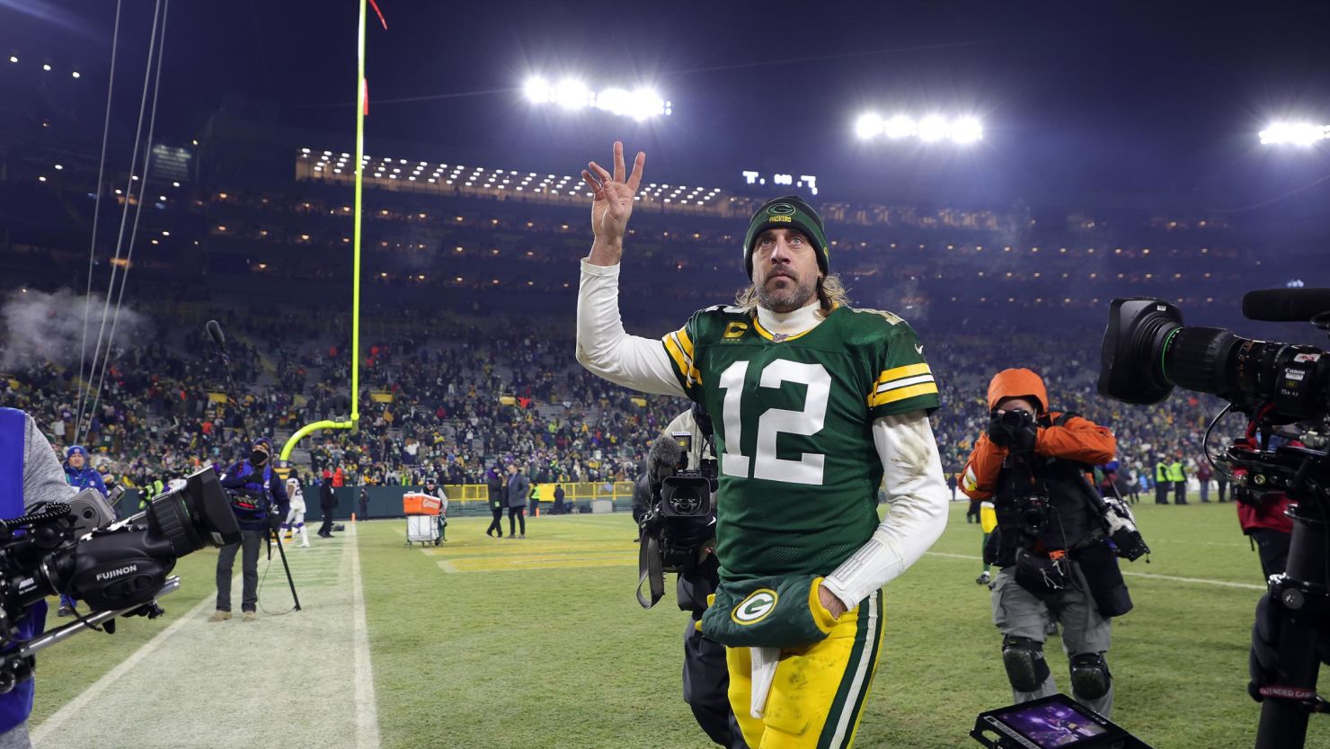 Aaron Rodgers walks off the field after the Packers defeated the Minnesota Vikings. 