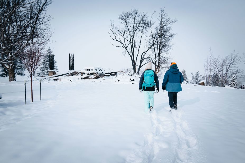 Katie and Nick Ferrington survey their home in Boulder County, Colorado, on January 1.