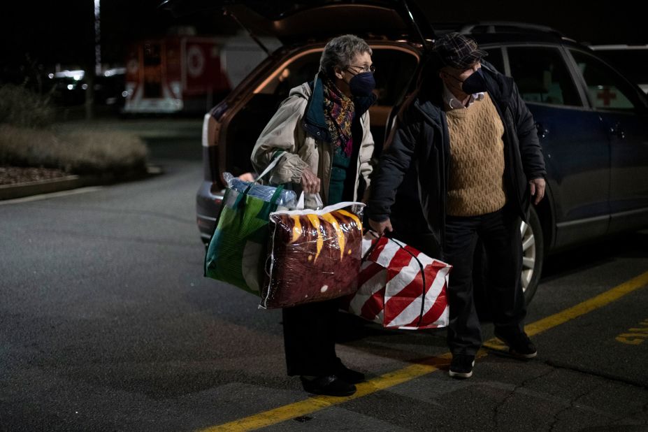 People deliver donations to the YMCA of Northern Colorado in Layafette, Colorado, on December 30.