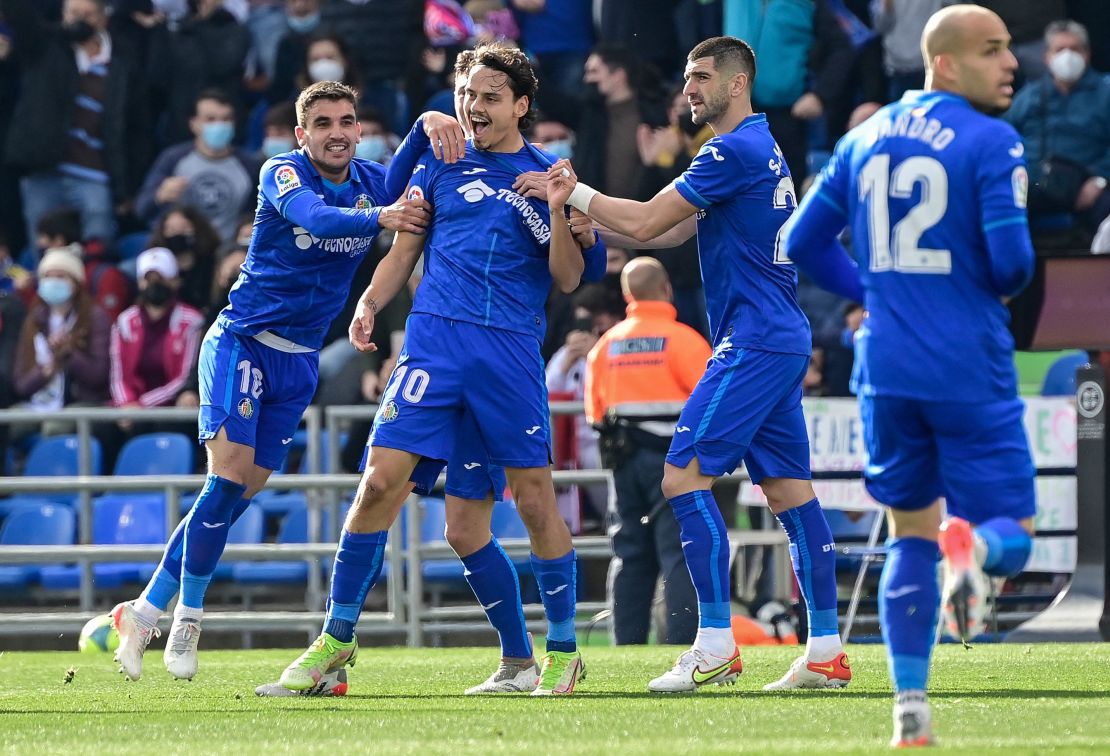 Getafe's Turkish forward Enes ünal celebrates after his early goal against Real Madrid.