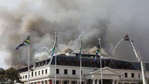 Smoke rises from South Africa's Parliament on Monday after the fire reignited late afternoon.