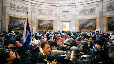 Police clash with supporters of US President Donald Trump who breached security and entered the Capitol building in Washington D.C., on January 6, 202