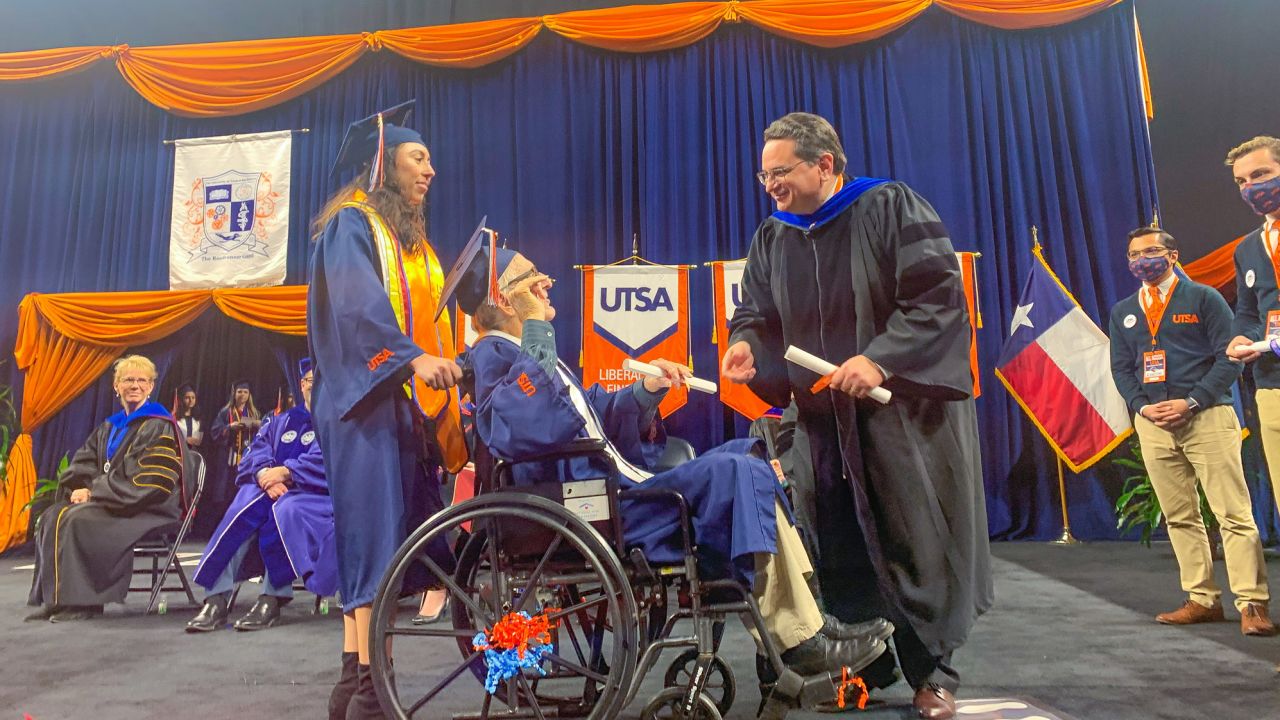 Salazar pushed Neira across the graduation stage to accept their college degrees.