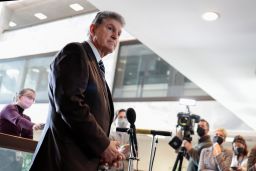 Sen. Joe Manchin speaks to reporters outside his office on Capitol Hill on Tuesday, January 4, 2022. 