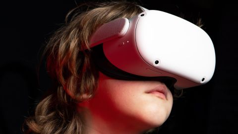 A kid wearing an Oculus Quest 2 VR head set.