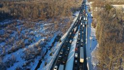 STAFFORD COUNTY, VIRGINIA - JANUARY 04: In an aerial view, traffic creeps along Virginia Highway 1 after being diverted away from I-95 after it was closed due to a winter storm on January 04, 2022 near Fredericksburg in Stafford County, Virginia. A winter storm with record snowfall slammed into the Mid-Atlantic states, stranding thousands of motorists overnight on 50 miles of I-95 in Virginia.  (Photo by Chip Somodevilla/Getty Images)