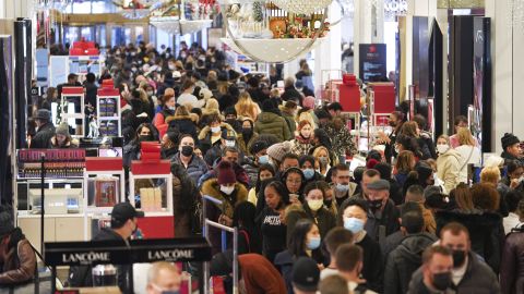 People shop at Macy's Herald Square store during Black Friday in New York, the United States, Nov. 26, 2021.