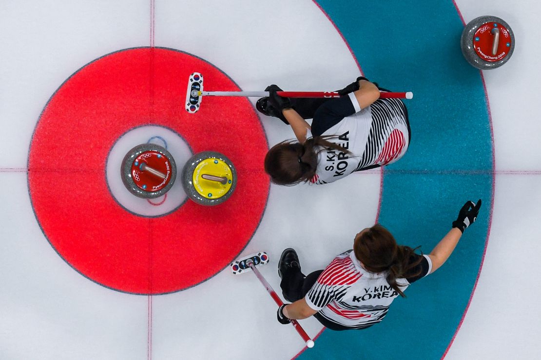 South Korea's Kim Seonyeong and Kim Yeongmi compete during the curling women's gold medal game between South Korea and Sweden during the Pyeongchang 2018 Winter Olympics.