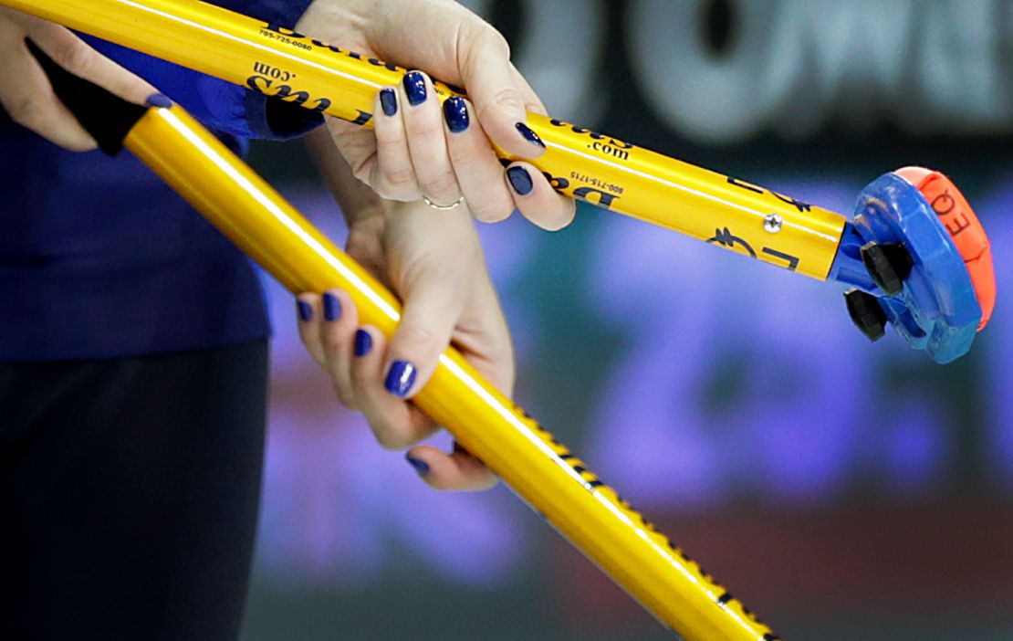 Sweden's Margaretha Sigfridsson (left) and Maria Prytz hold onto their brooms during the women's curling semifinal against Switzerland at the 2014 Winter Olympics.
