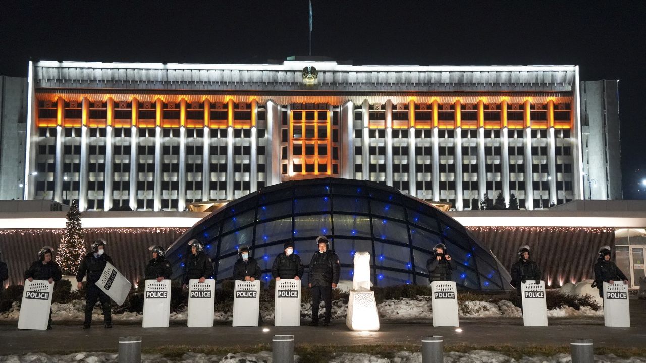 Riot police block protesters in Almaty on January 5, 2022.