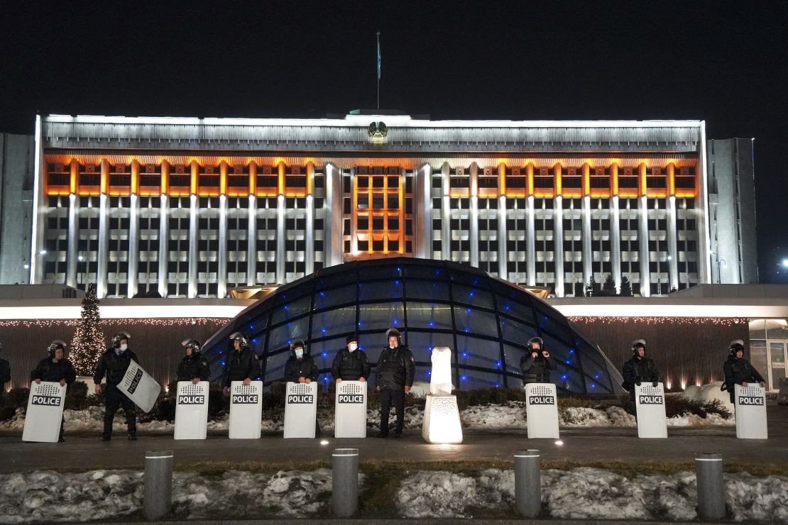 Riot police block protesters in Almaty on January 5, 2022.