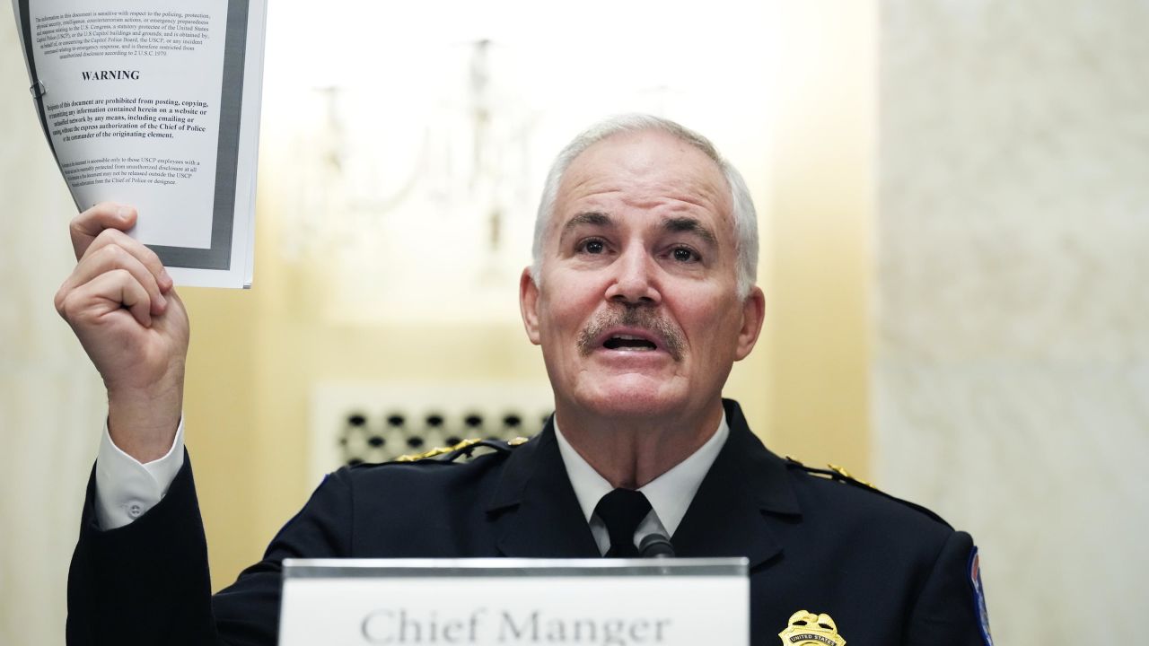 U.S. Capitol Police Chief J. Thomas Manger holds up a statutory congressional security information report while testifying during the Senate Rules and Administration Committee oversight hearing on January 5, 2022 in Washington, D.C.