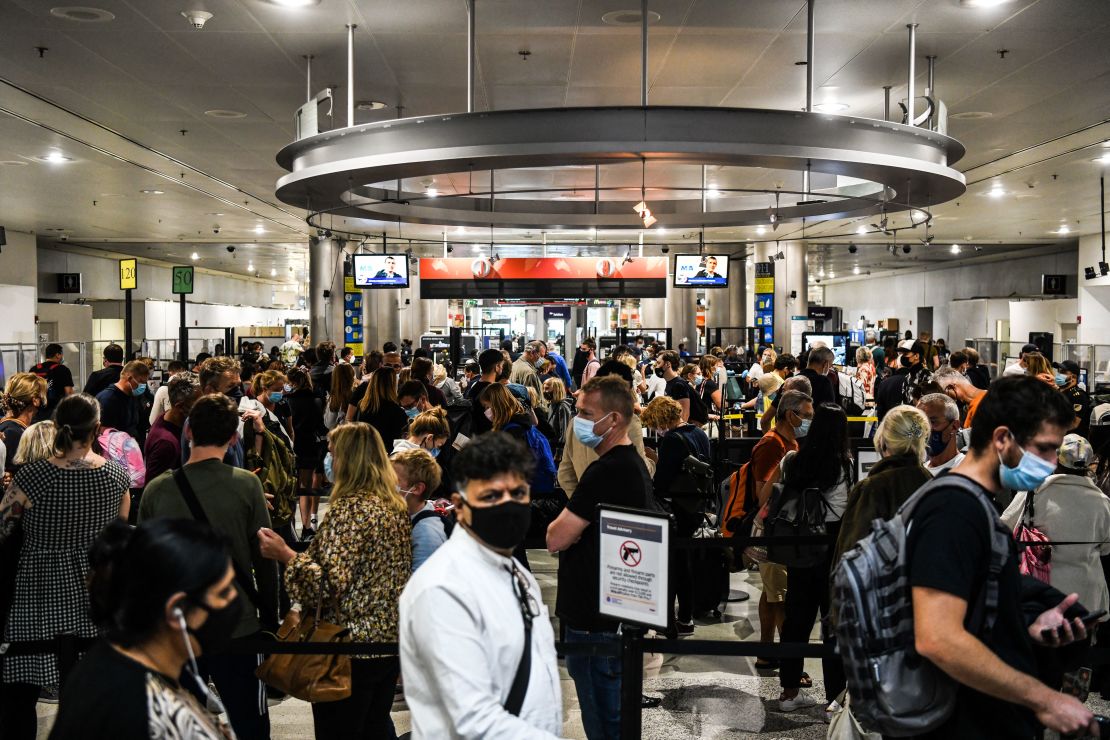 Travelers wait in security lines at Miami International Airport on January 3.