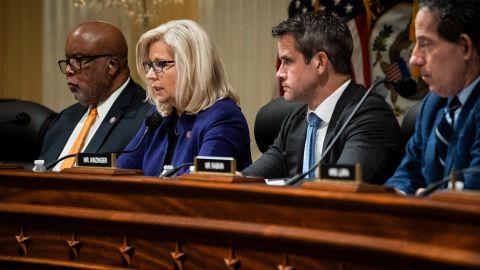 Vice Chair Liz Cheney, flanked by Chairman Bennie Thompson (left) and Rep. Adam Kinzinger, speaks as the House committee investigating January 6 meets on October 19, 2021, in Washington. 