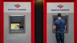 A person uses an automated teller machine (ATM) outside a Bank of America branch in San Francisco, California, U.S., on Thursday, Jan. 14, 2021. 