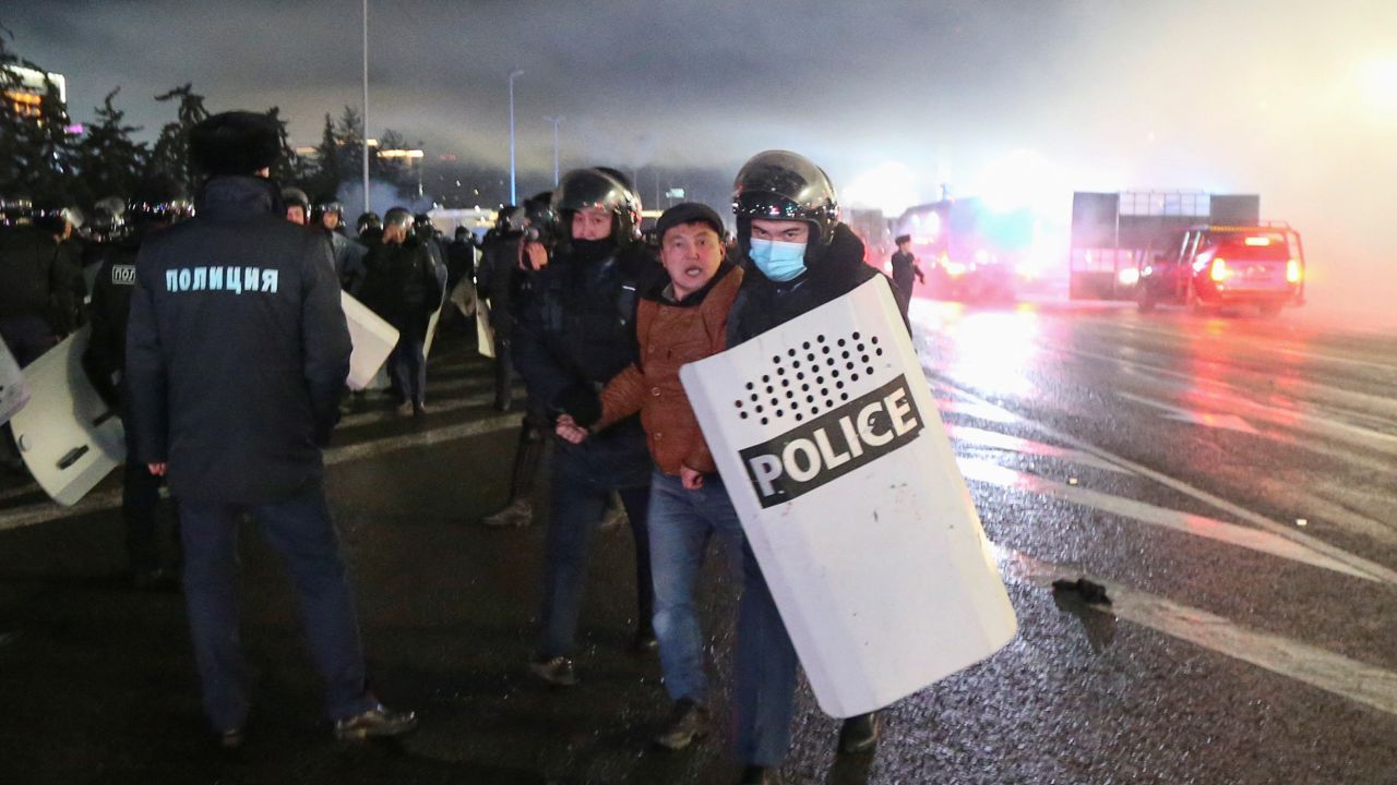 Officers detain a man during a protest in Almaty on January 5..