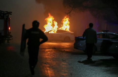 A police car burns during a protest in Almaty on January 5.