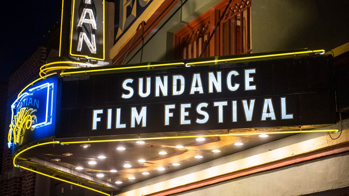 FILE - The marquee of the Egyptian Theatre appears during the Sundance Film Festival in Park City, Utah on Jan. 28, 2020.  The Sundance Film Festival is cancelling its in-person festival and reverting to an entirely virtual edition due to the current coronavirus surge. Festival organizers announced Wednesday, Jan 5, 2022, that the festival will start as scheduled on Jan. 20, but will shift online. Last year's Sundance was also held virtually because of the pandemic.  (Photo by Arthur Mola/Invision/AP, File)