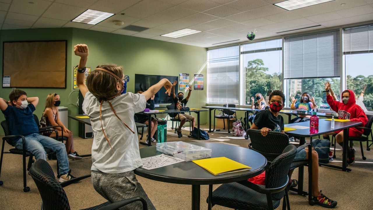 Children wear masks during a class activity at the Xavier Academy on August 23, 2021 in Houston, Texas.