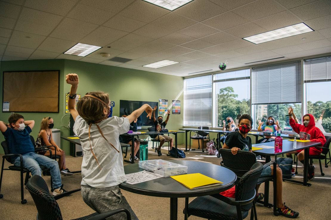 Children wear masks during a class activity at the Xavier Academy on August 23, 2021 in Houston, Texas.