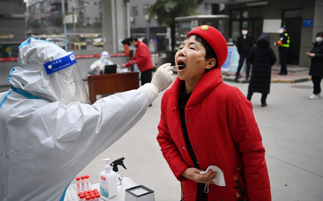 A resident receives a nucleic acid test in Xi'an, China, on January 4. 