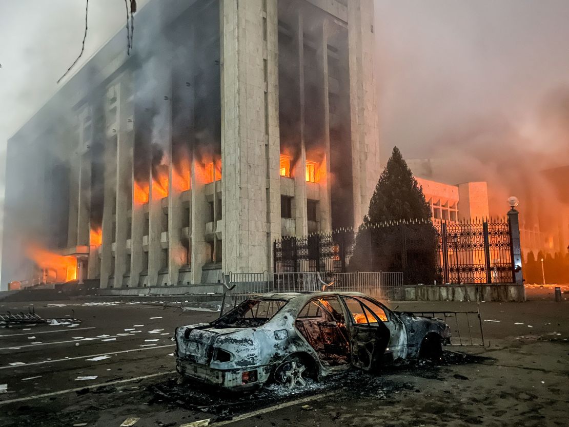 A burnt car is seen by the mayor's office on fire in Almaty, Kazakhstan on January 5. 