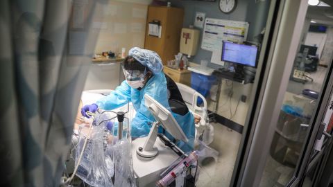 A health care worker at UMass Memorial Medical Center tends to a Covid-19 ICU patient in Worcester, Massachusetts.