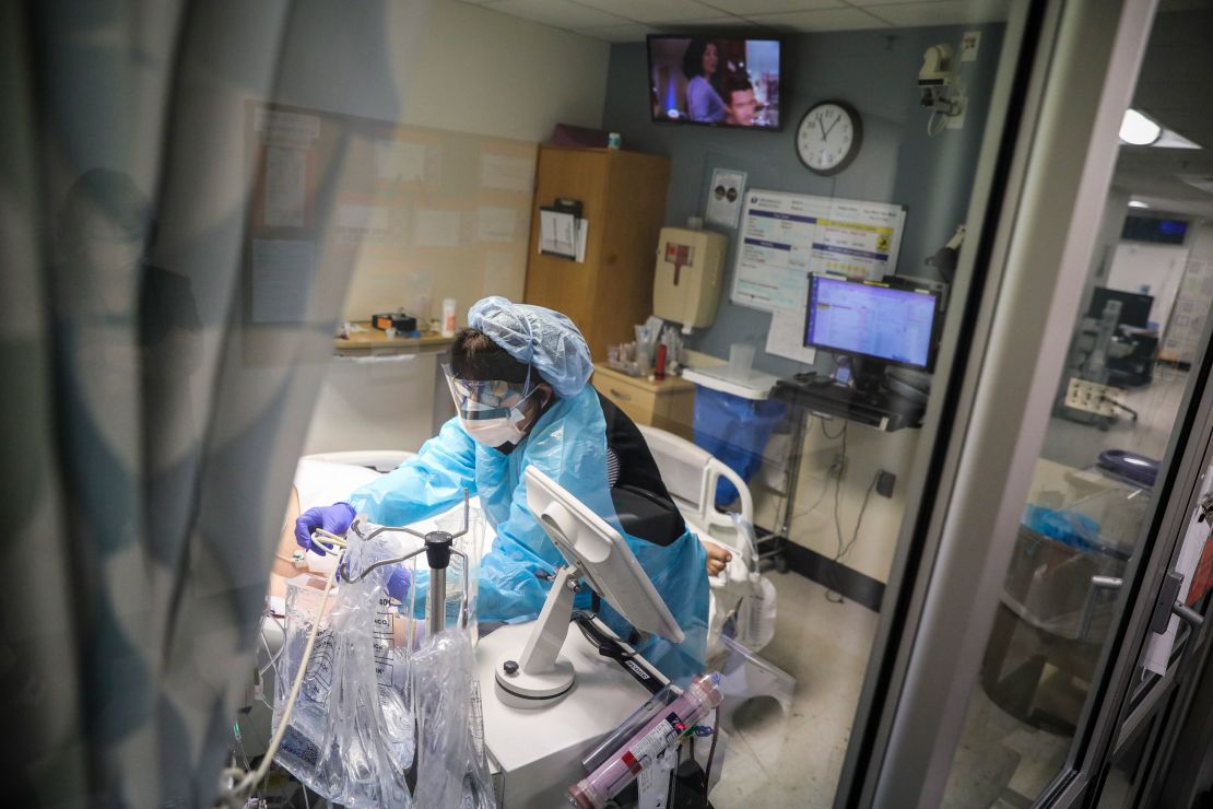 A health care worker at UMass Memorial Medical Center tends to a Covid-19 ICU patient in Worcester, Massachusetts.
