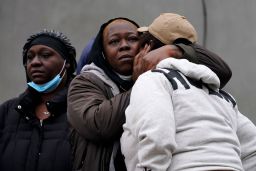 People react near the scene of a deadly row house fire on Wednesday, January 5, 2022, in the Fairmount neighborhood of Philadelphia. 