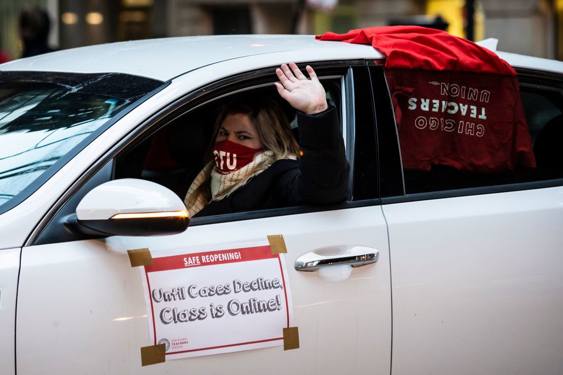 Members of the Chicago Teachers Union and supporters stage a car caravan protest outside City Hall in the Loop, Wednesday evening, January 5, 2022.