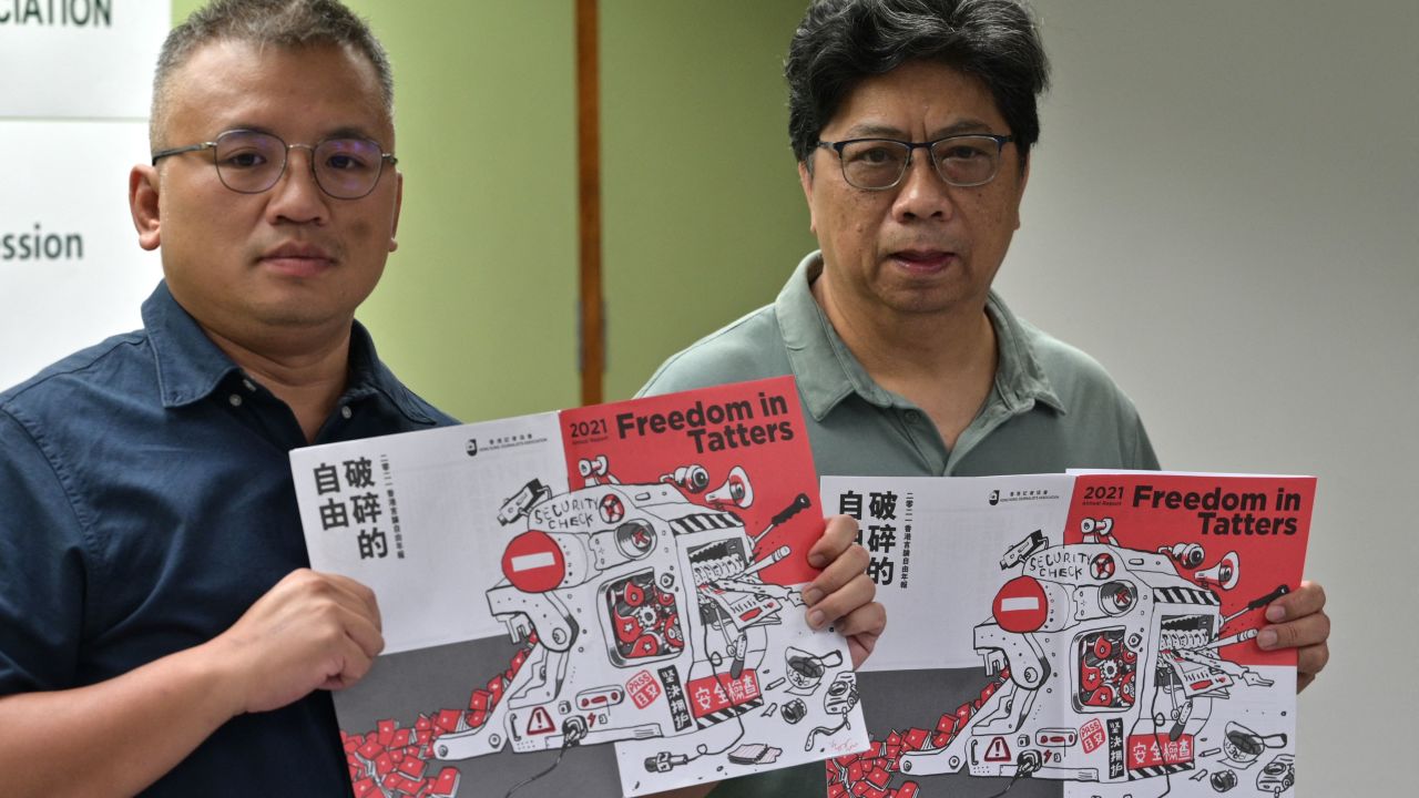 Chairperson of the Hong Kong Journalists Association Ronson Chan, left, and Chris Yeung pose during a press conference for the release of the organization's annual report on July 15, 2021. 