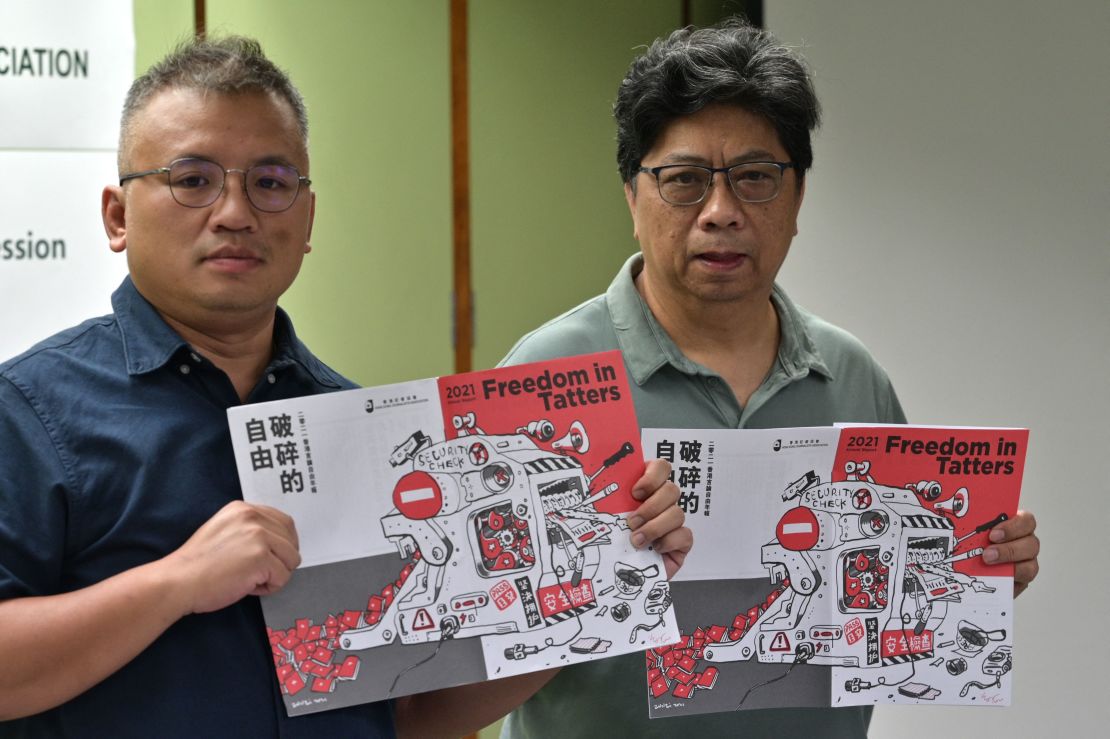 Chairperson of the Hong Kong Journalists Association Ronson Chan, left, and Chris Yeung pose during a press conference for the release of the organization's annual report on July 15, 2021. 