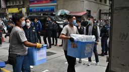 LAM TIN, KWUN TONG, CHINA - 2021/12/29: Police officers carry news material and evidence in blue plastic boxes after searching the office of Stand News.
Amid the political suppression, Hong Kong independent news outlet was raided and searched by 200 police officers. Stand news Editorial board members, editors and pre board member pop-singer Denis Ho were arrested. (Photo by Alex Chan Tsz Yuk/SOPA Images/LightRocket via Getty Images)