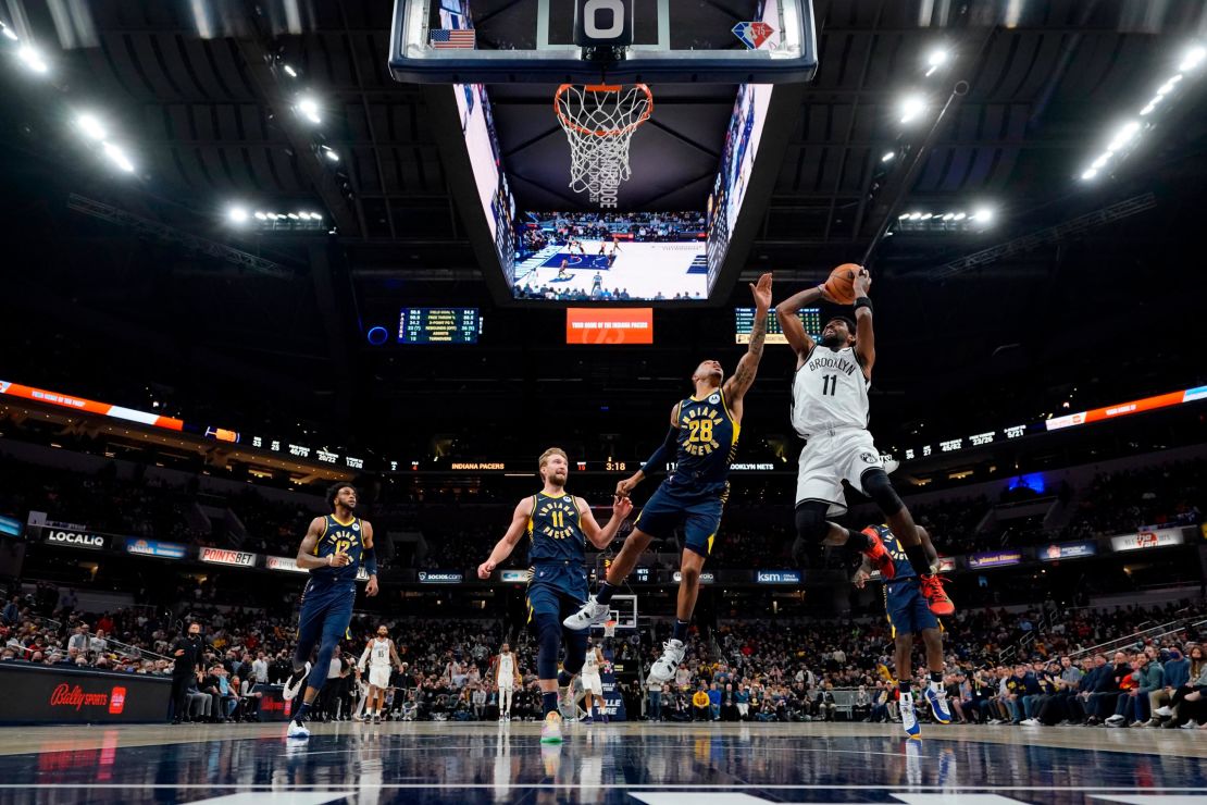 Irving drives to the basket.