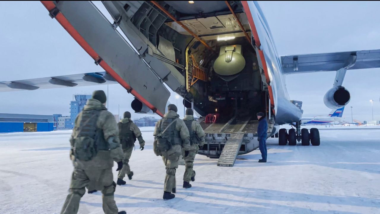 This image, taken from a handout video made available by the Russian Defense Ministry's press service, shows Russian servicemen boarding a military aircraft on their way to Kazakhstan January 6. They were part of the military alliance that answered an appeal for help from Kazakhstan's President.