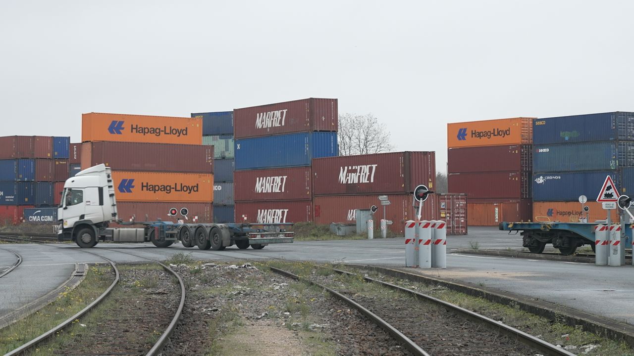 Workers at Valenton station, in France, unloading a train that arrived from Xi'an, China, on December 14, 2021.