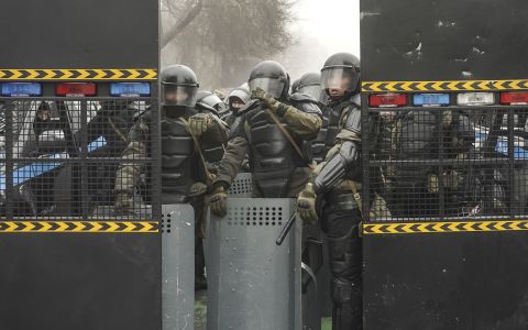 Police officers wear riot gear during a protest in Almaty on January 5.