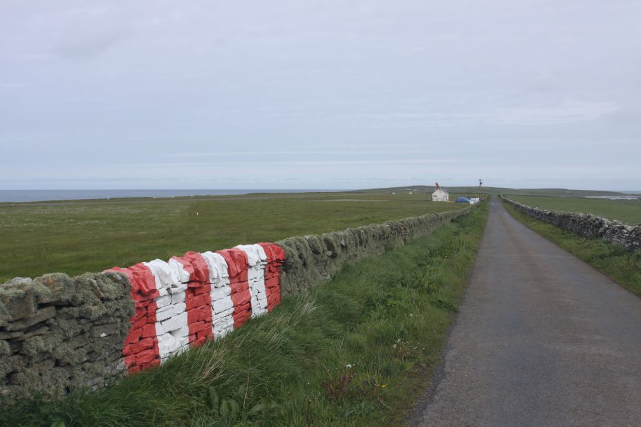 <strong>Runway's end: </strong>Stripes painted on a traditional dry stone wall serve as a navigational marker for one of Papa Westray's landing strips. 