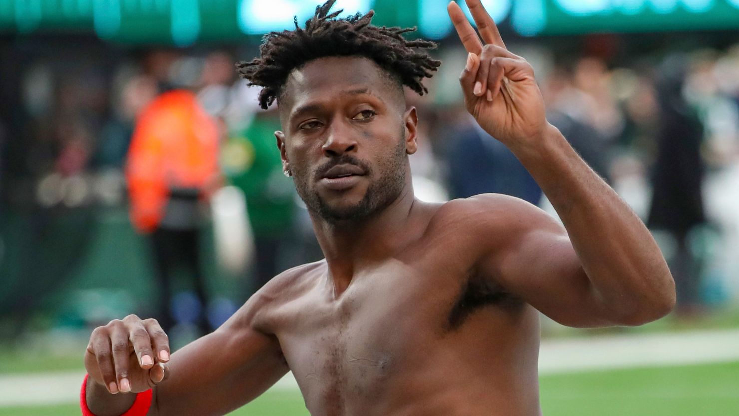 Antonio Brown gestures to the crowd as he leaves the field while his team's offense is on the field against the New York Jets.