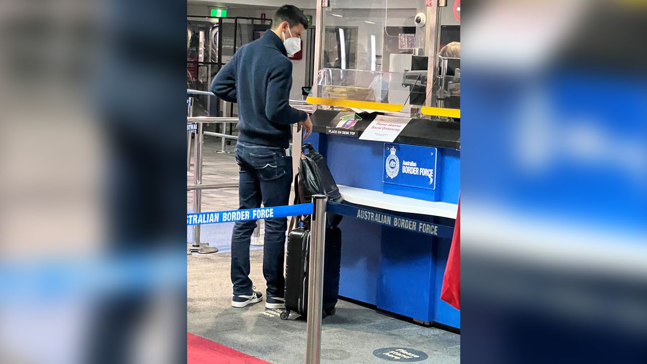 Djokovic stands at a booth of the Australian Border Force in Melbourne on Wednesday.