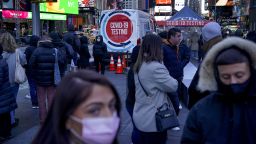 People wait in a long line to get tested for COVID-19 in Times Square, New York, Dec. 20, 2021. 