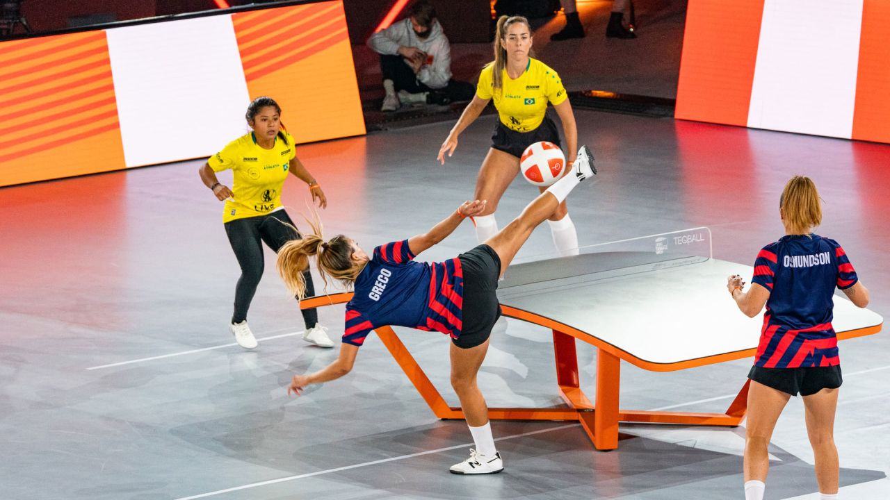 USA's Carolyn Greco smashes the ball against Brazil's Natalia Guitler and Rafaella Fontes during the Teqball World Championships.